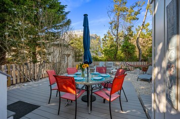 Fully fenced backyard with outdoor table and a FIRE TABLE for cooler nights!