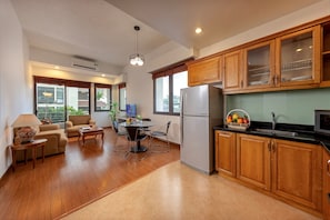 Executive Apartment, 2 Bedrooms, Pool View, Poolside | Living area | Flat-screen TV