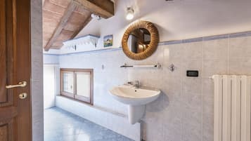 Bathtub, hair dryer, bidet, towels