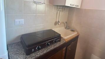 Fridge, stovetop, coffee/tea maker, cookware/dishes/utensils