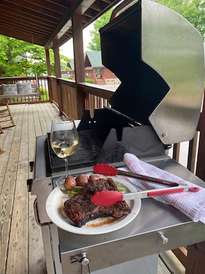 Enjoy al fresco dining on the deck with a grill, side burner, and comfortable seating.