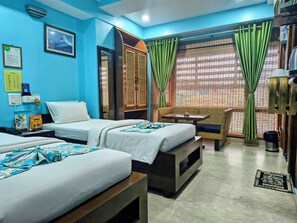 Egyptian cotton sheets, premium bedding, in-room safe, desk - Rains Inn (Guwahati)