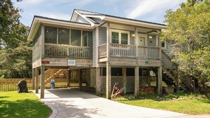 A two-story house with a balcony and a deck. - Blue Crab:  Spacious screened porch, short stroll to Ocracoke Coffee Co.. (Ocracoke)