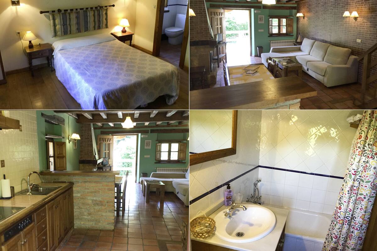 A multi-room accommodation with a bed, sofa, dining area, kitchen, and bathroom.