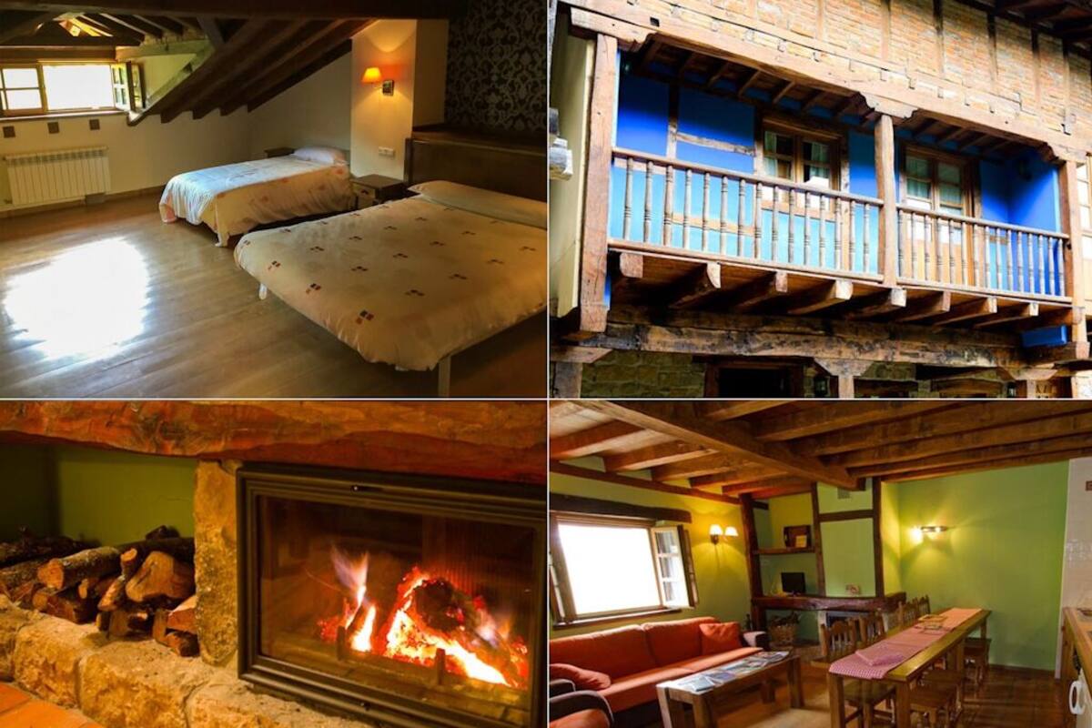 A multi-level building with a loft bedroom, a dining area, a living room, and a fireplace.