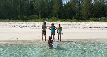 Island Gypsy, a serene beachfront apartment on Cocoa Bay for up to 4 guests.