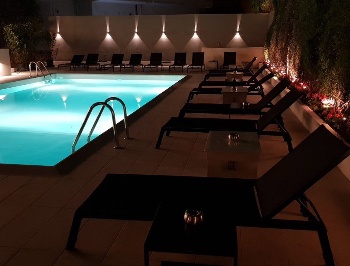 seasonal outdoor pool, open 11:00 am to 7:00 pm, pool umbrellas