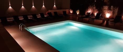 Seasonal outdoor pool, open 11:00 AM to 7:00 PM, pool umbrellas