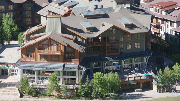 A large, multi-story lodge with a prominent central building featuring large windows and a balcony. - Our studio condo is the closest condo to the Eagle Lift.  Just steps away. (Frisco)