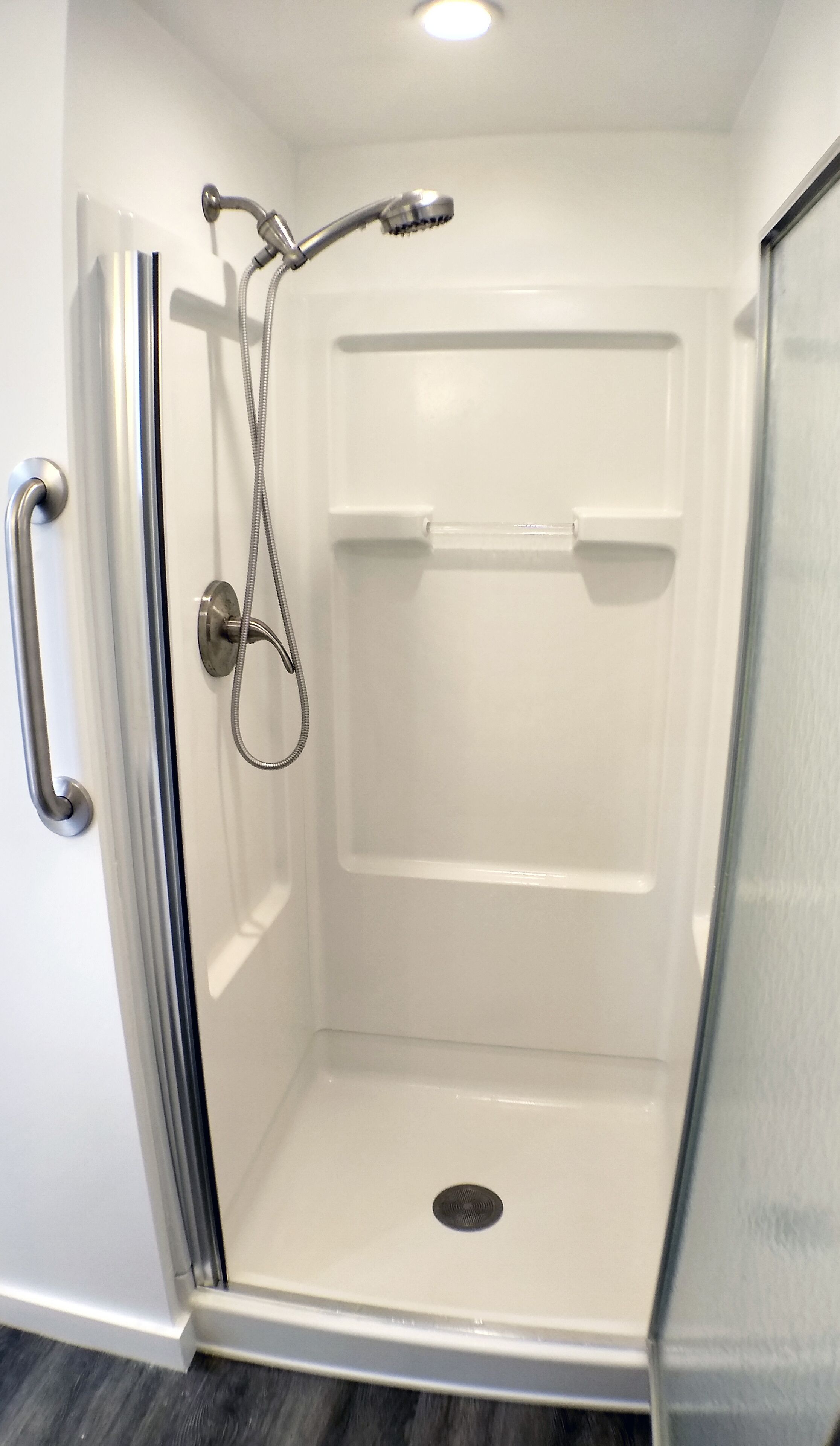 Shower, hair dryer, towels, toilet paper