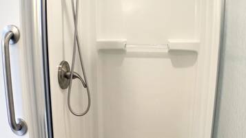 Shower, hair dryer, towels, toilet paper