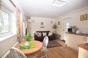 Cottage with Double Bed | Living area | -32-inch flat-screen TV with digital channels, TV, DVD player