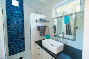 Shower, hair dryer, towels, soap