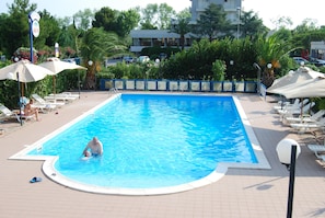 Outdoor pool, a rooftop pool, sun loungers
