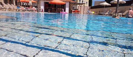 Outdoor pool, pool umbrellas, pool loungers