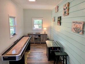 Games room - Sun-Inspired: Pet friendly, saltwater pool, large yard, screened porch. (Ocracoke)