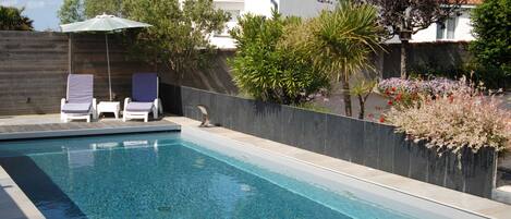 Seasonal outdoor pool, a heated pool, pool loungers