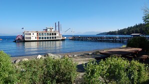 A riverboat docked at a pier with a clear view of the water and distant mountains. - Large fenced yard with Hot Tub, Serene and quiet. (Carnelian Bay)