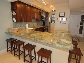 Fridge, microwave, oven, stovetop - Gulf-Front Luxury: 2BR Beachplace Condo on Longboat Key Unit 9-103 by RVA (Longboat Key)