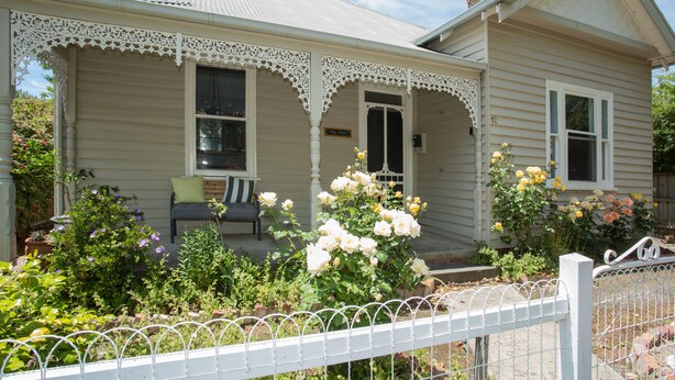 A house with a porch, a garden with flowers, and a white fence. - Central, Classic, Contemporary , Comfortable, Convenient , Charming (Ballarat Central)