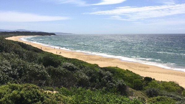 On the beach, sun-loungers