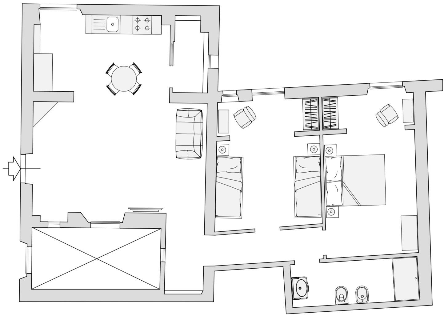Un plan d’étage d’hôtel comprenant une cuisine, un coin repas, deux chambres et une salle de bain.