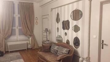 Double Room (La Rempart) | Living area | Flat-screen TV