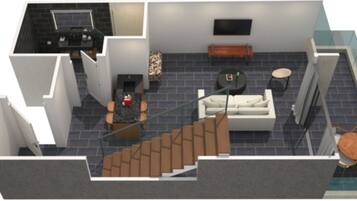 A 3D floor plan of a hotel room with a kitchen, a living area with a sofa and coffee table, a dining area with a table and chairs, and a staircase.