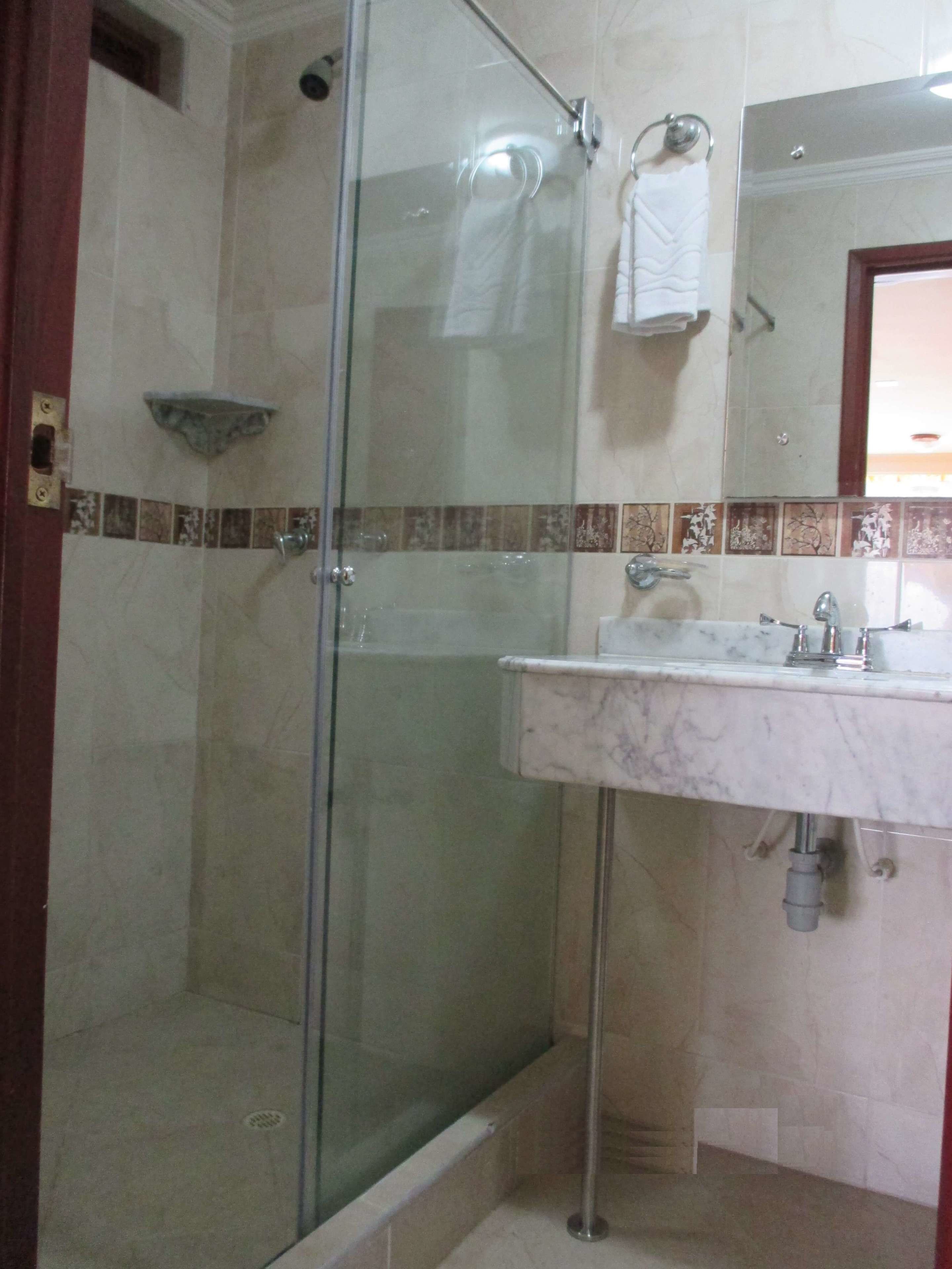 standard triple room | bathroom | shower, towels