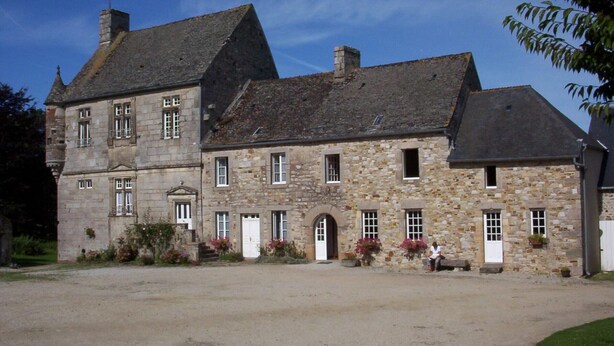 A large stone building with multiple windows and a central entrance. - Semi-detached house with 4 bedrooms at Manoir de la Barguignerie (Saint-Christophe-du-Foc)