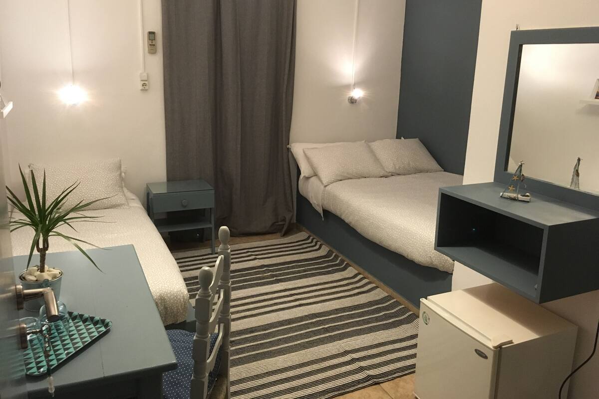 Triple Room | Living area | Flat-screen TV