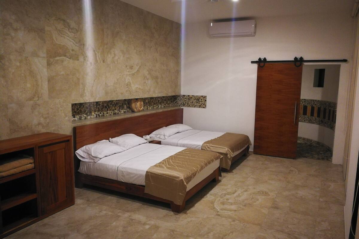 family suite, 1 bedroom, bathtub, lagoon view | 1 bedroom, desk, blackout curtains, bed sheets