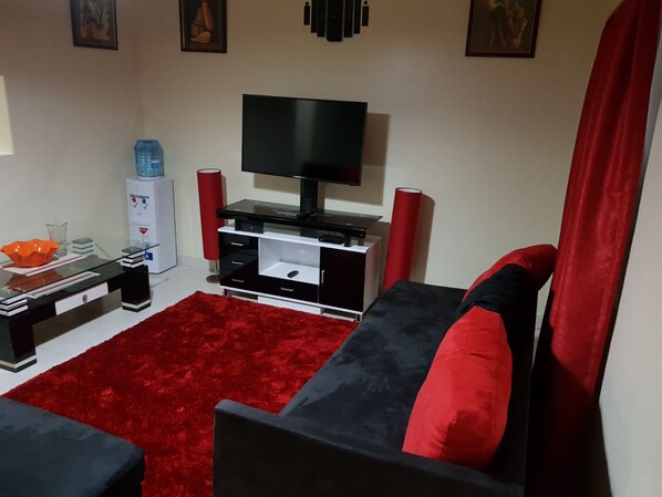 Comfort House, 3 Bedrooms | Living area | Flat-screen TV