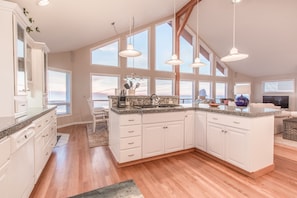 Enjoy cooking in this well-lit kitchen with a large island and stove.