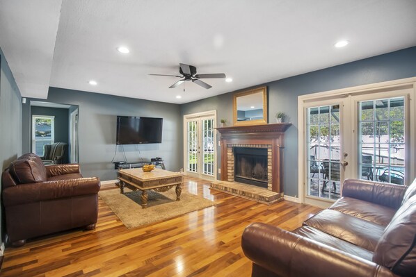 Executive Villa, 4 Bedrooms | Living area | 55-inch flat-screen TV with cable channels, TV, fireplace