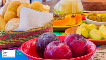A table with various food items including bread, cheese, and fruits.