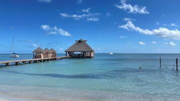 Private beach, white sand, sun loungers, beach umbrellas