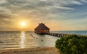 Private beach, white sand, sun loungers, beach umbrellas