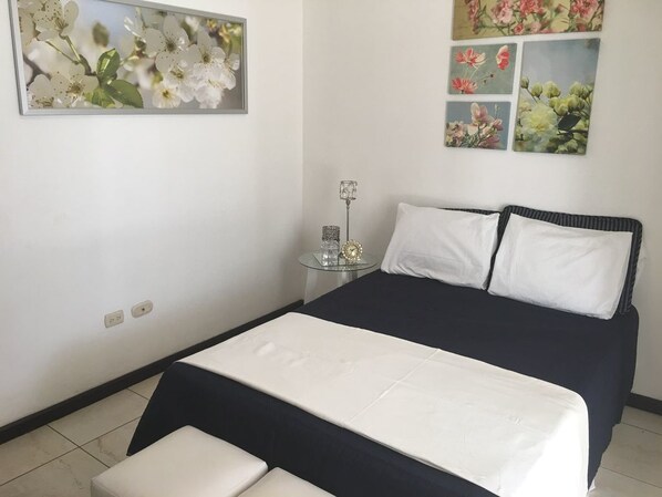 Suite Deluxe, varias habitaciones | 1 habitación, ropa de cama de alta calidad y minibar 