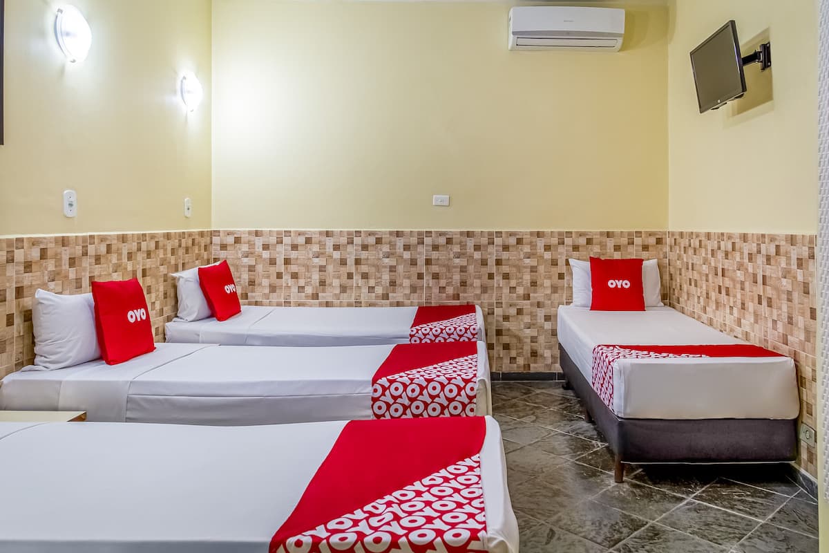 Economy Quadruple Room | Minibar, desk, iron/ironing board (on request), free WiFi