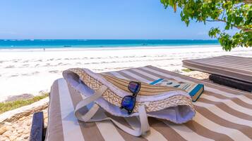 On the beach, sun-loungers, beach towels