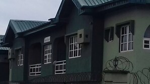 A building with multiple windows, a metal roof, and a barred entrance. - Entire, spacious, furnished 3beds en-suite, as holiday let with BrausengDelight (Lagos)