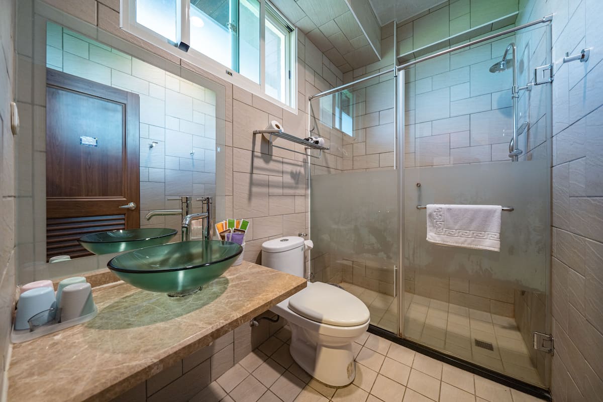 quadruple room | bathroom | shower, free toiletries, hair dryer, slippers