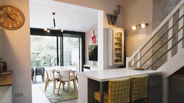 A modern kitchen with a dining area, a staircase, and a view of the outdoors. - GASSIN / FONT-MOURIER: 1/2-BEDROOM MAZET IN ESTATE WITH POOL AND TENNIS (GASSIN)