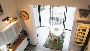 A modern kitchen with a dining area, a large window, and a staircase. - GASSIN / FONT-MOURIER: 1/2-BEDROOM MAZET IN ESTATE WITH POOL AND TENNIS (GASSIN)