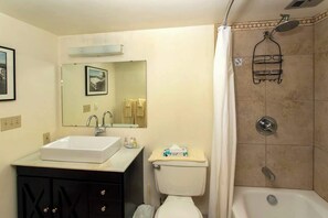 Shower, hair dryer, towels, shampoo