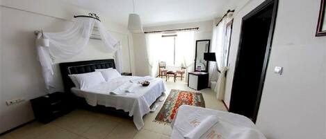 Family Quadruple Room | Free minibar, iron/ironing board, free cribs/infant beds, free WiFi