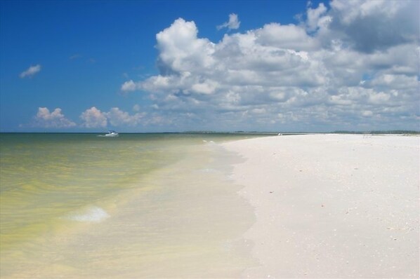 Enjoy serene beach activities like boating and swimming in this tranquil setting.