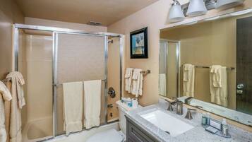 Shower, hair dryer, towels, shampoo