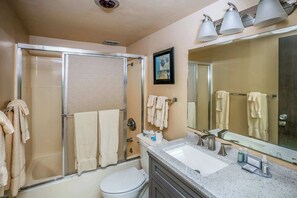 Shower, hair dryer, towels, shampoo